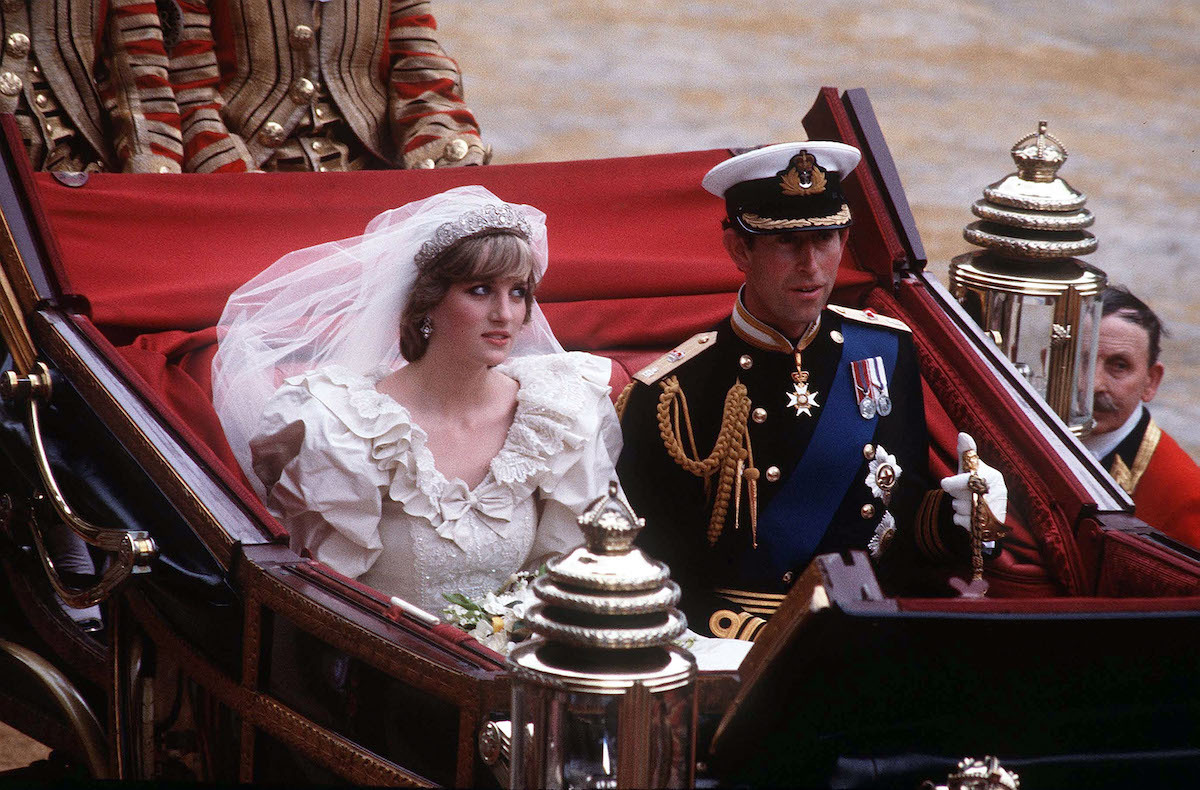 Princess Diana and Prince Charles riding in a carriage following their wedding in 1981