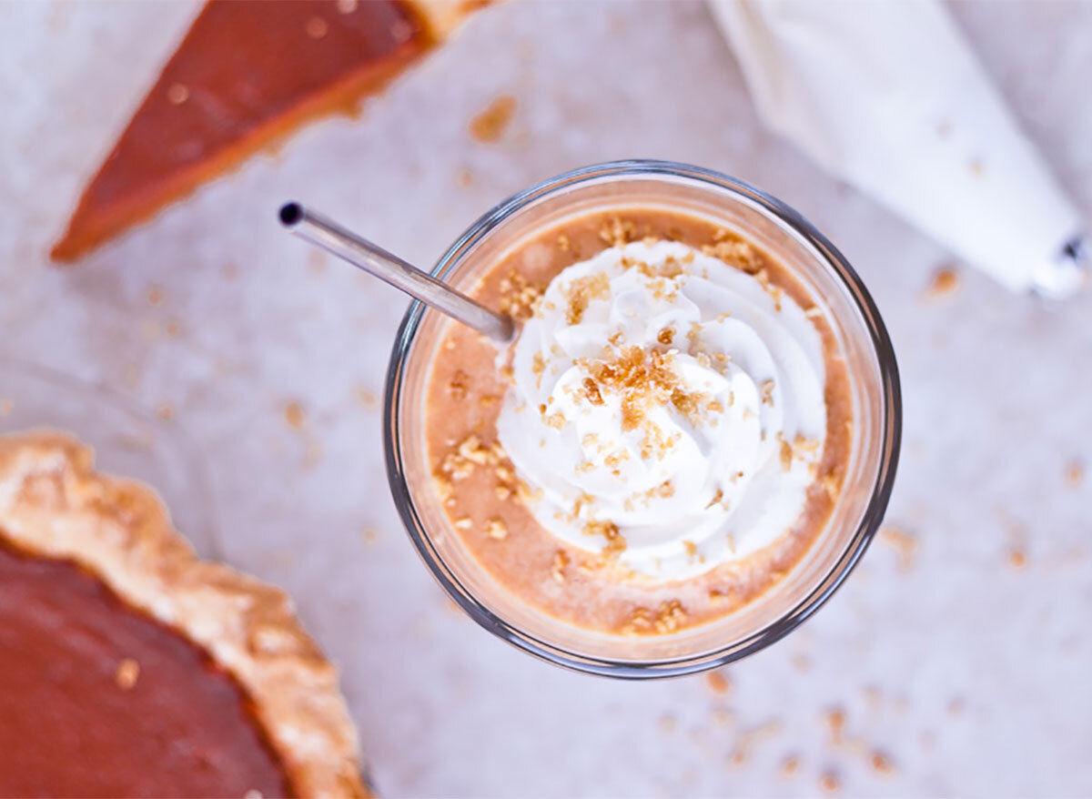 pumpkin pie milkshake in glass with whipped cream