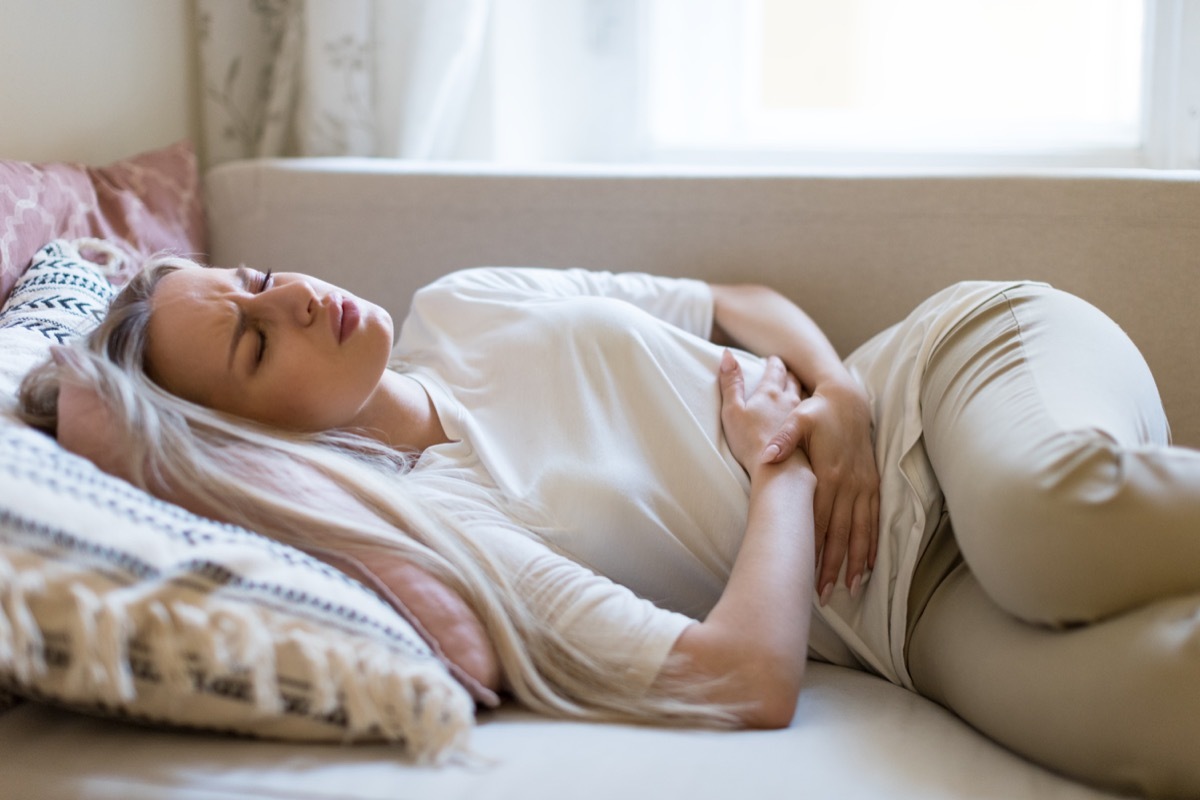 Woman in discomfort experiencing digestive issues