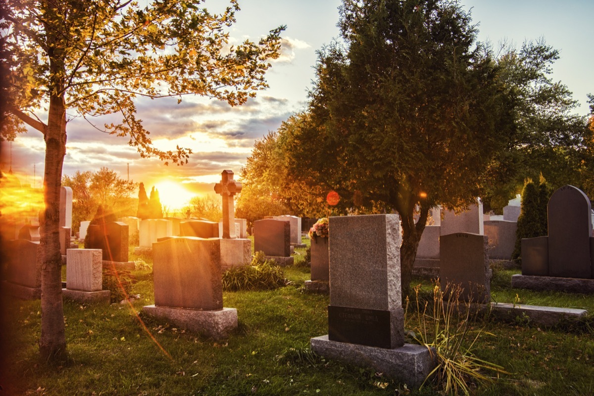 a cemetery during sunrise