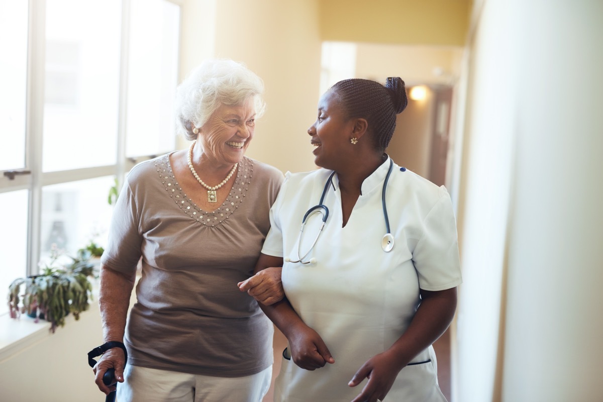 doctor or nurse and patient in nursing home