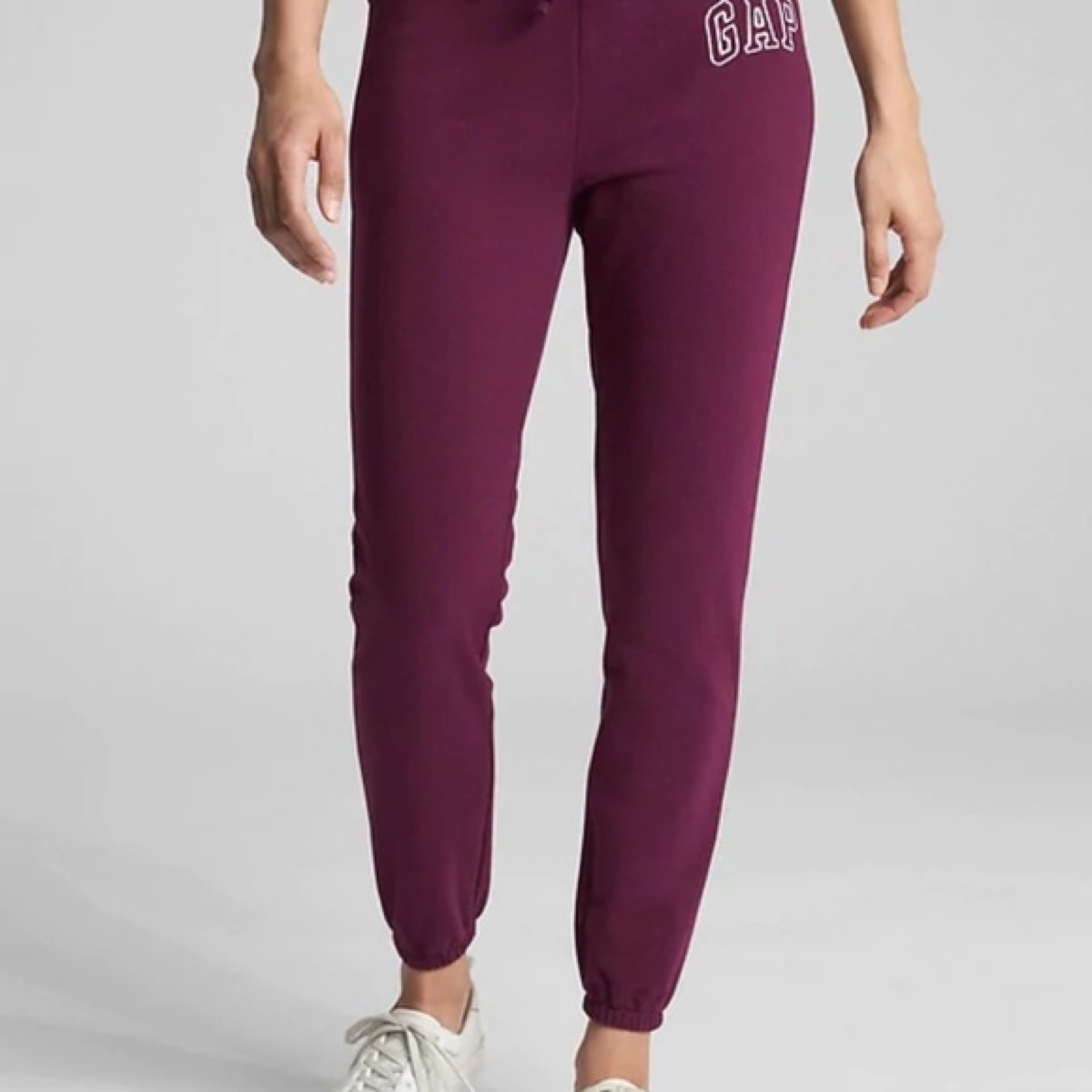 Woman wearing burgundy jogging pants