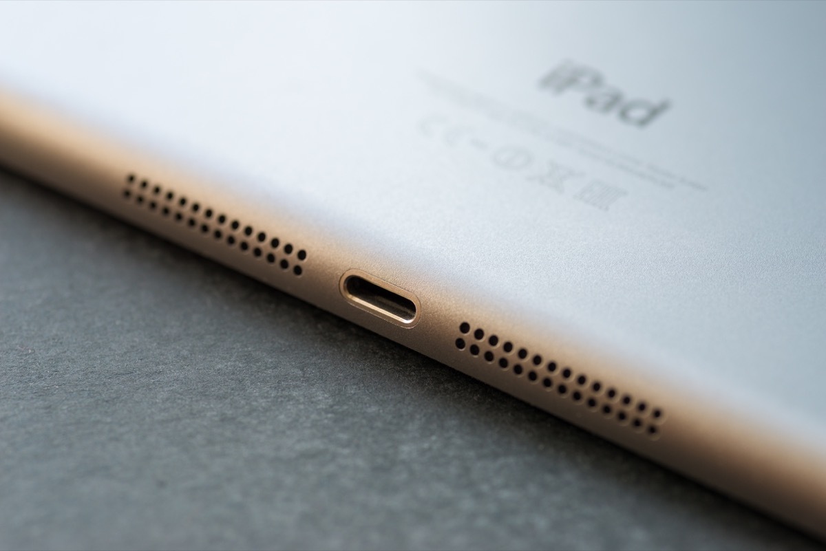 VLADIVOSTOK, RUSSIA - JUNE 4, 2014: Apple Lightning Connection port on Ipad mini. Is a proprietary conniction used to connect mobile devices such as iPhones, iPads or iPods to computers.
