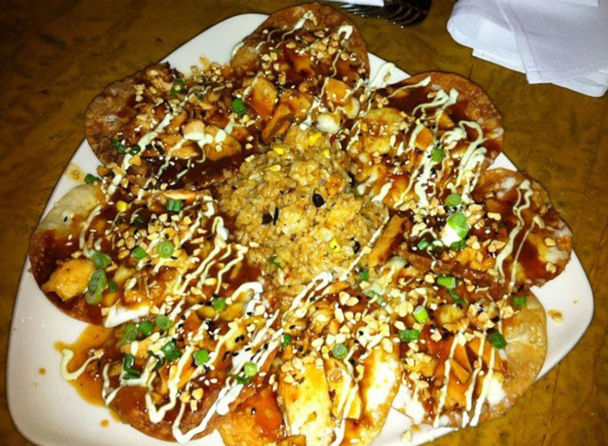 grand lux cafe asian nachos on white plate