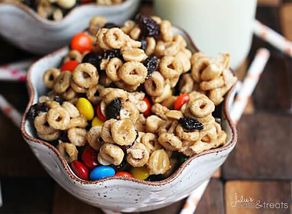 bowl of cheerios snack mix with mms and nuts