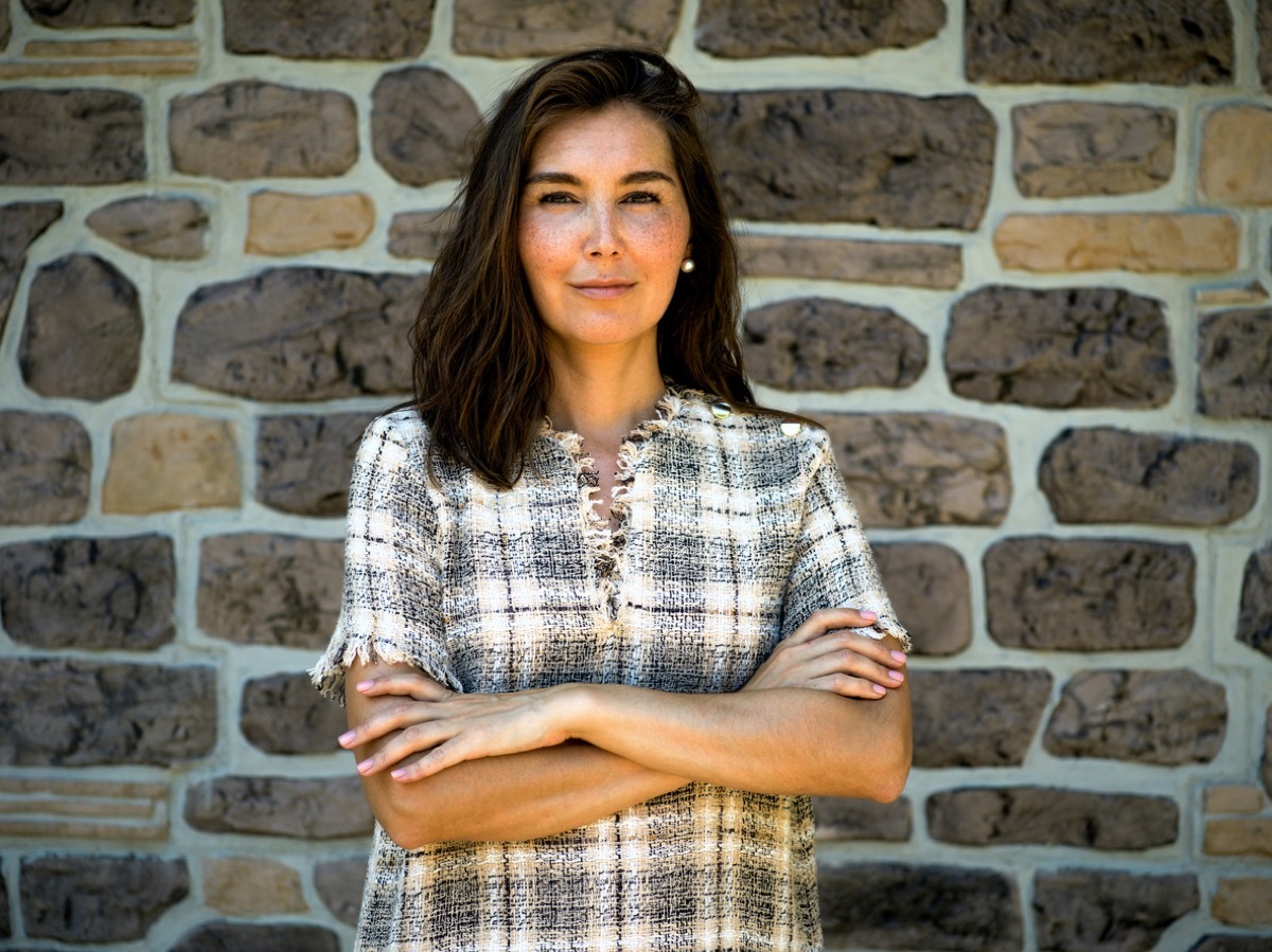 professional woman wearing plaid dress