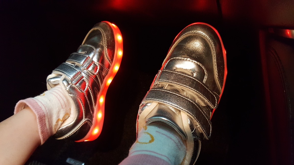 kid wearing light-up sneakers