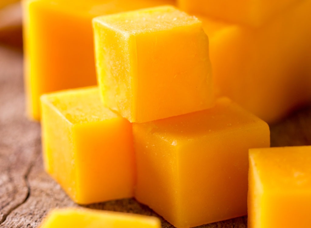 stacked cubes of cheddar cheese