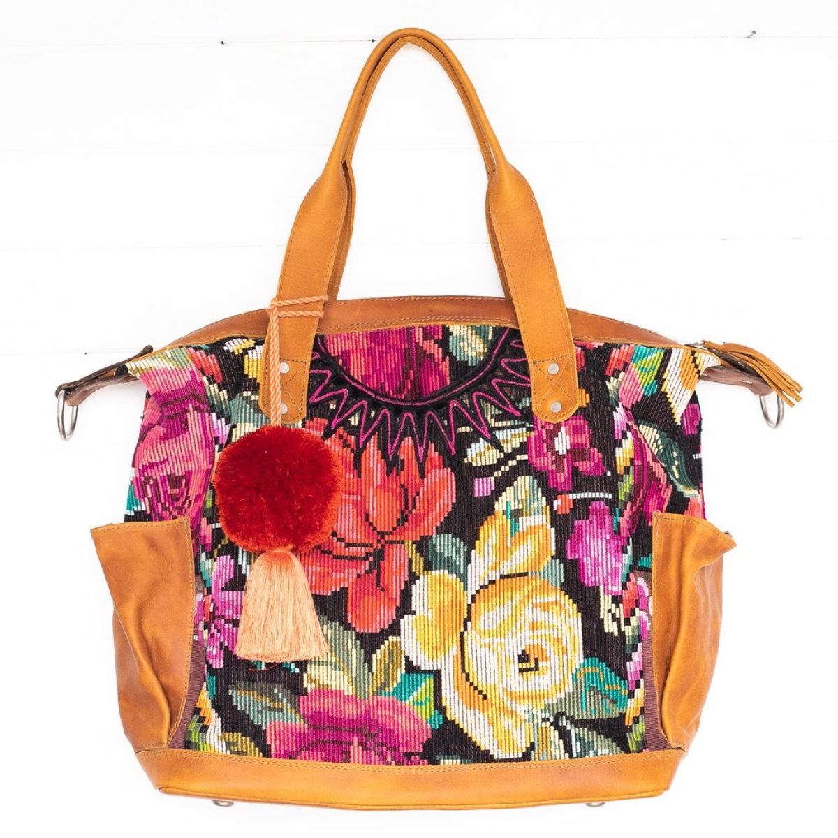 Floral embroidered bag with pom pom
