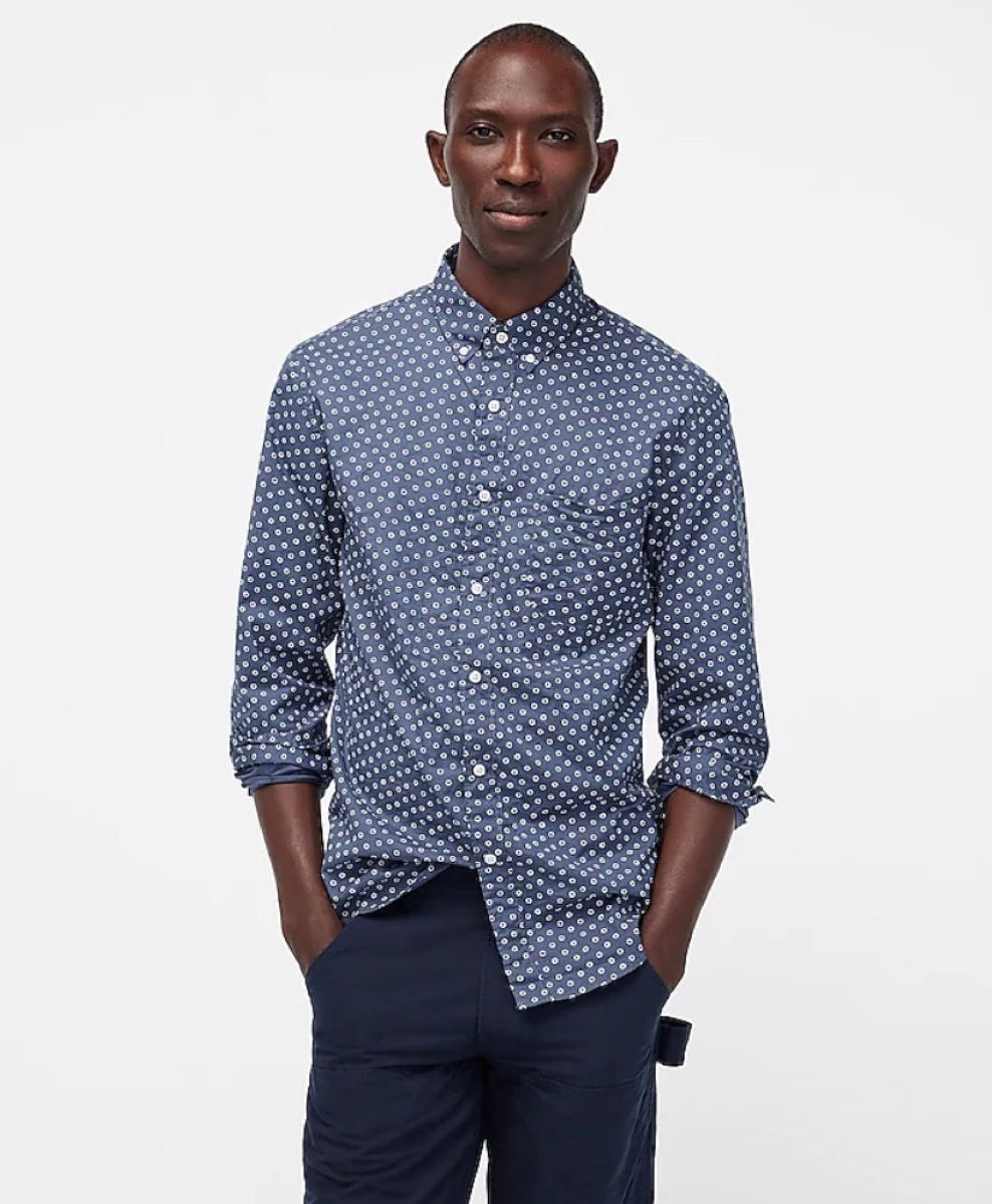 young black man in blue button down shirt