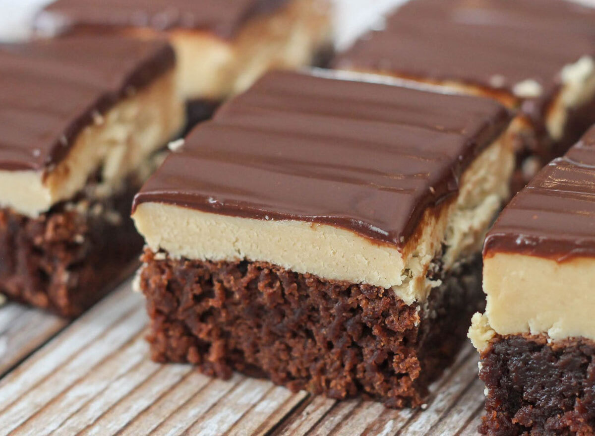 buckeye brownies on tray topped with peanut butter and fudge