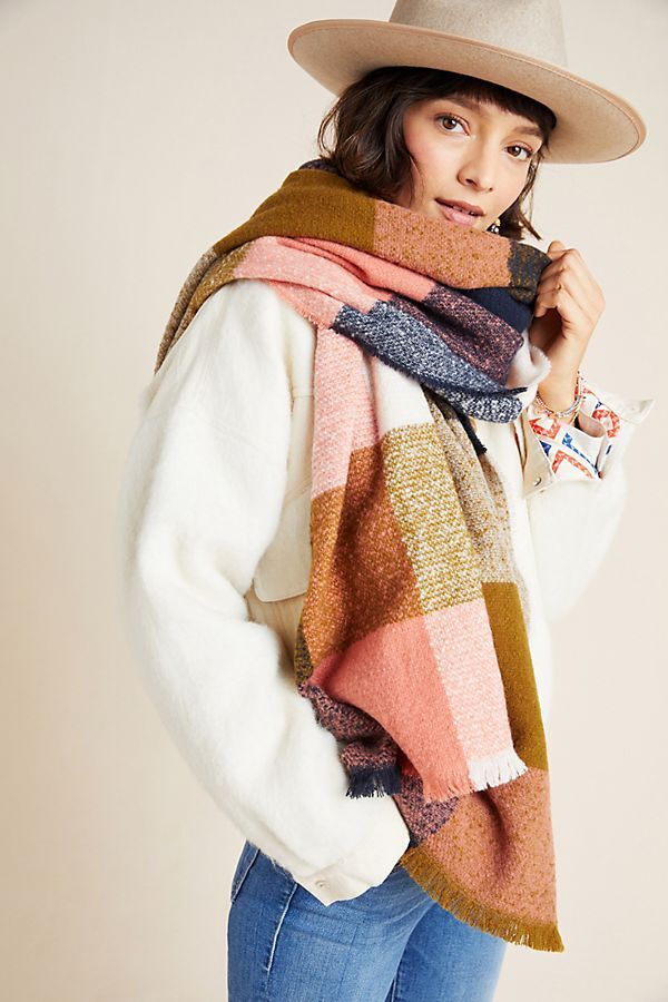 white woman wearing patchwork scarf