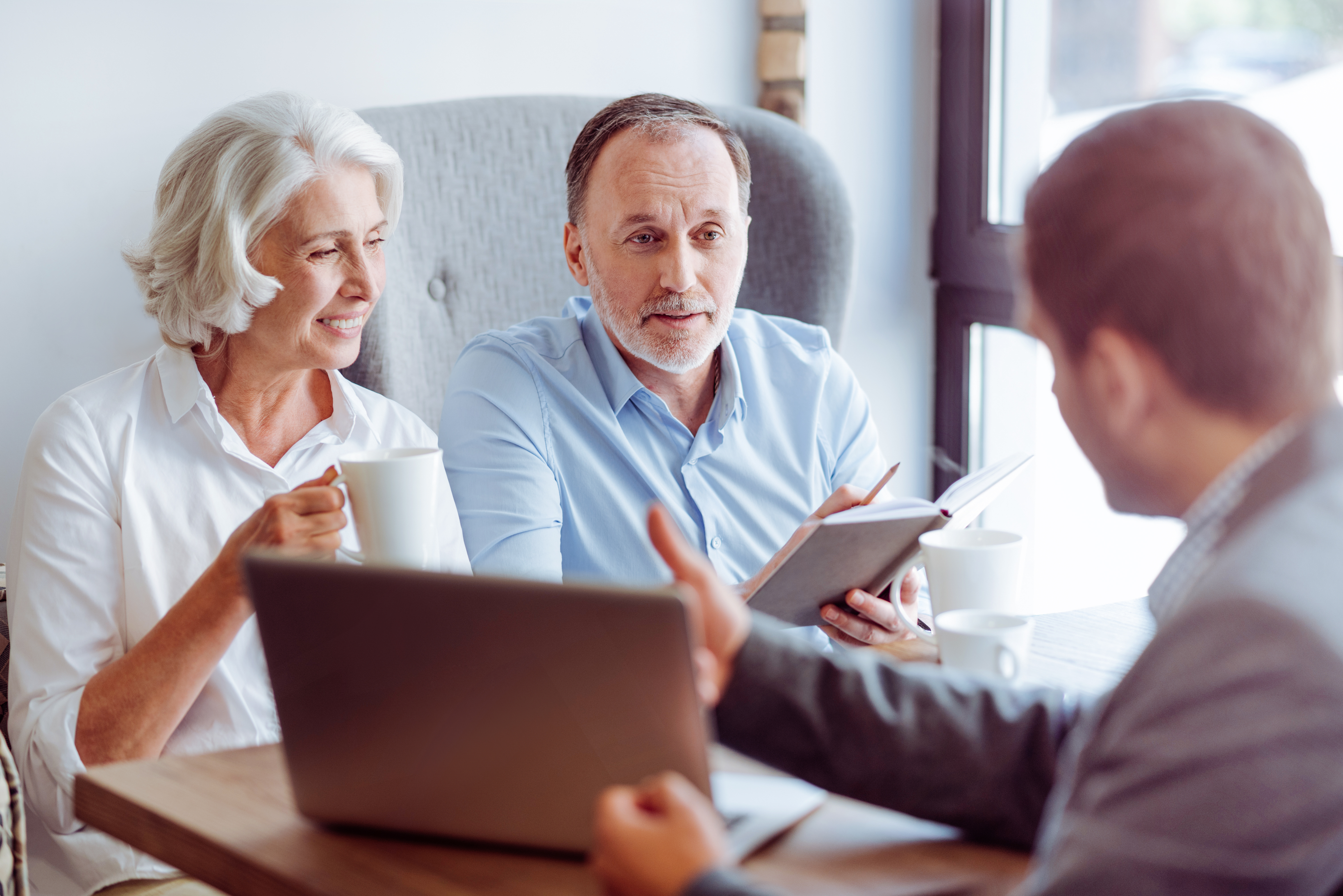 mature couple meeting with financial advisor