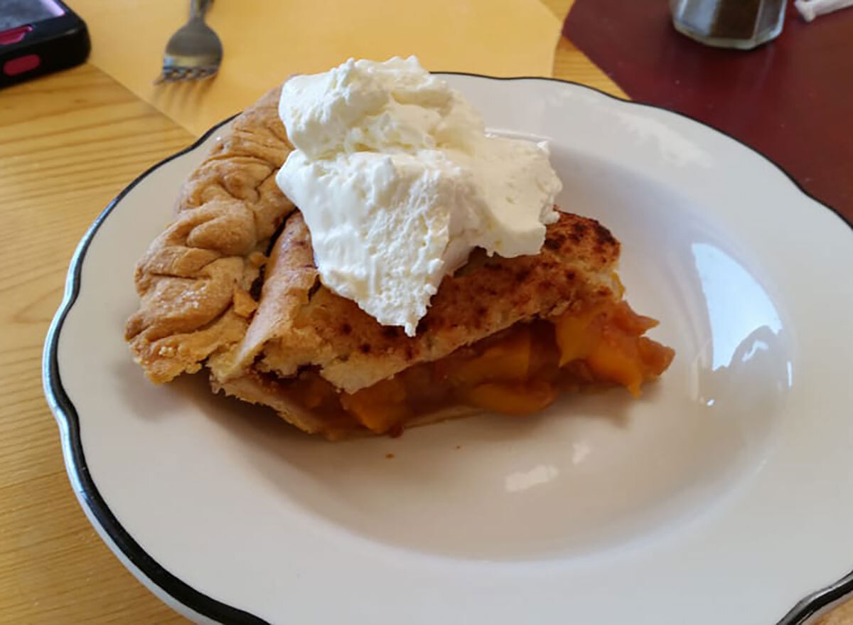 slice of peach pie on plate