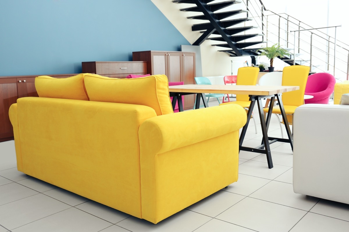 A bright yellow couch vintage home trends