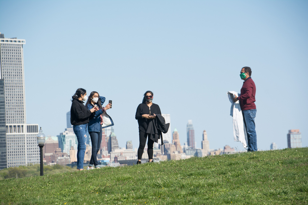 A family prepares to have a picnic in Liberty State Park, during Covid-19 pandemic