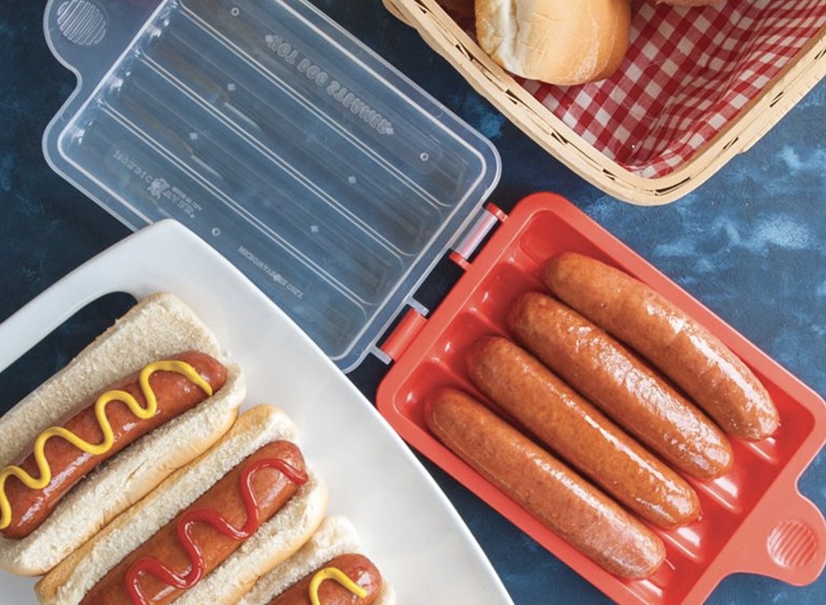 hot dogs in red microwave tray and on white plate