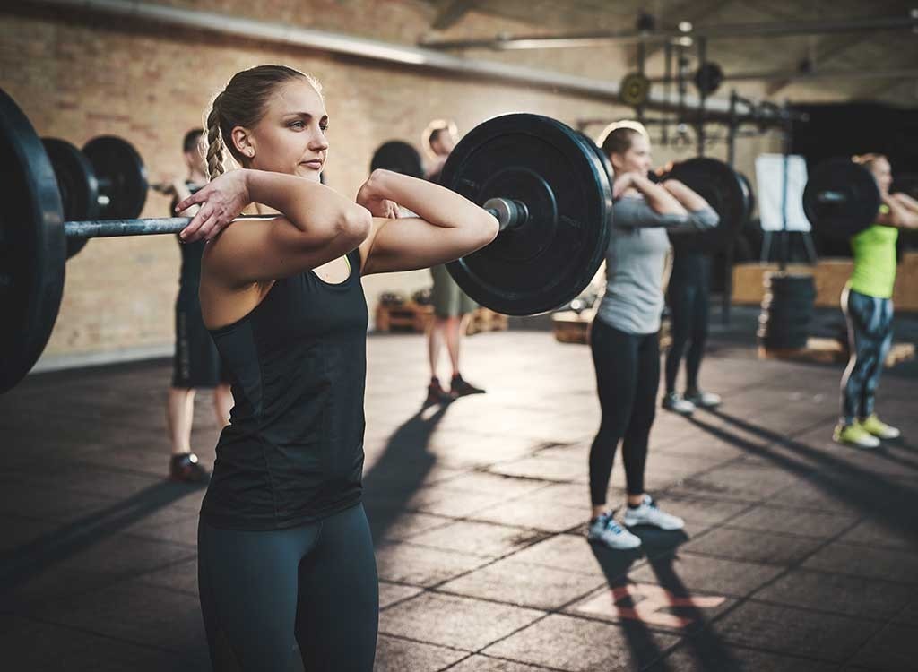 girl lifting large weight