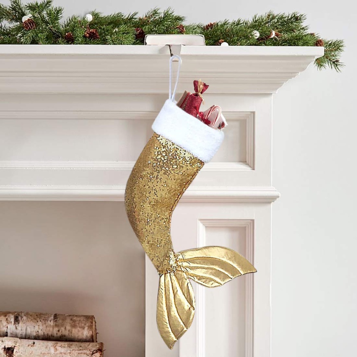 gold stocking with mermaid tail hung on mantle