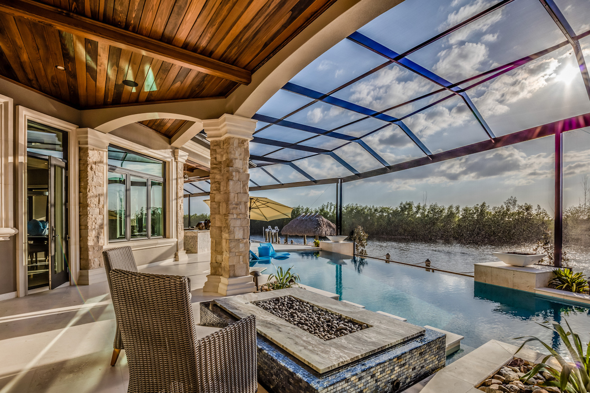 fire pit and wood ceiling covering add beauty to the patio