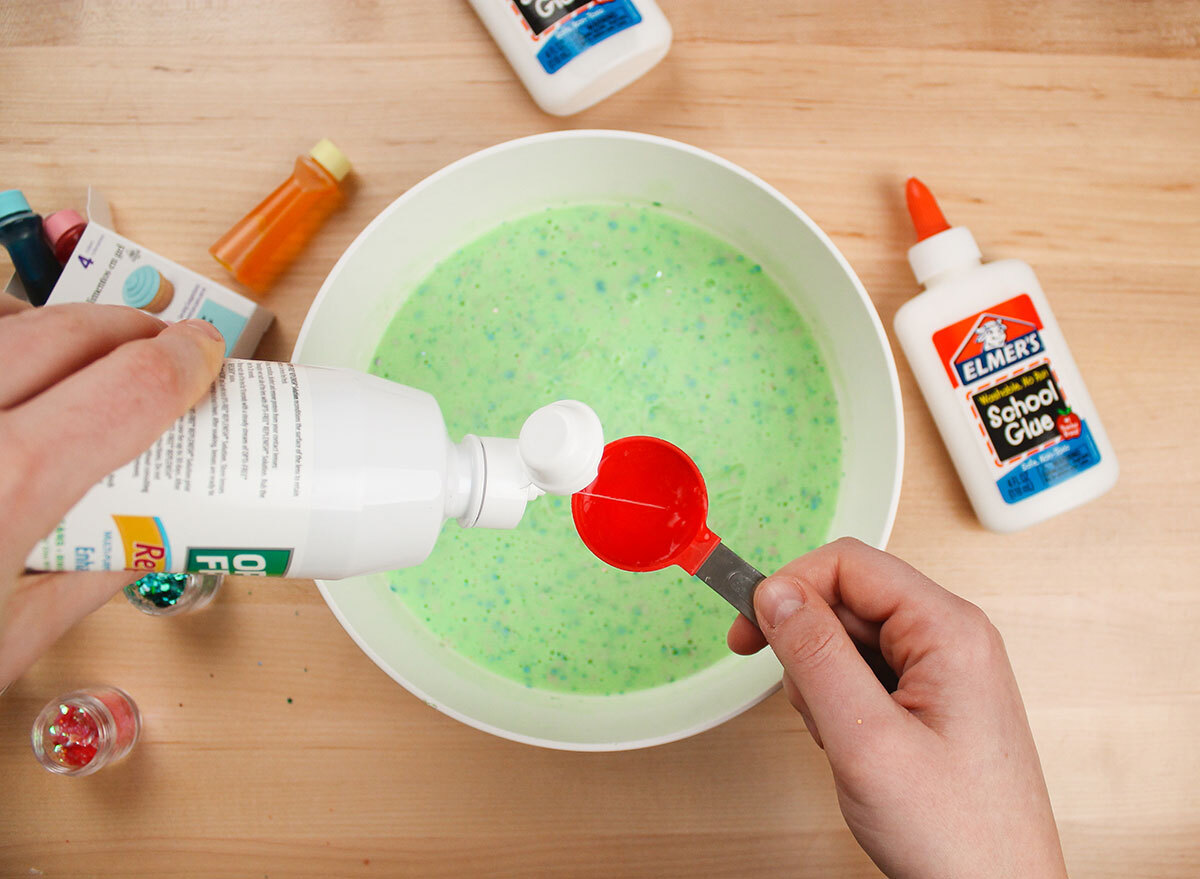 adding contact solution to slime mixture