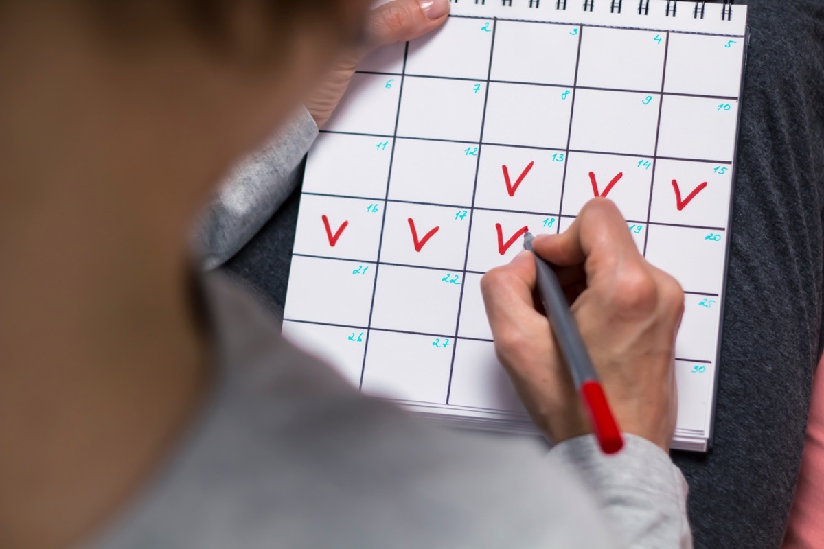 woman marking calendar