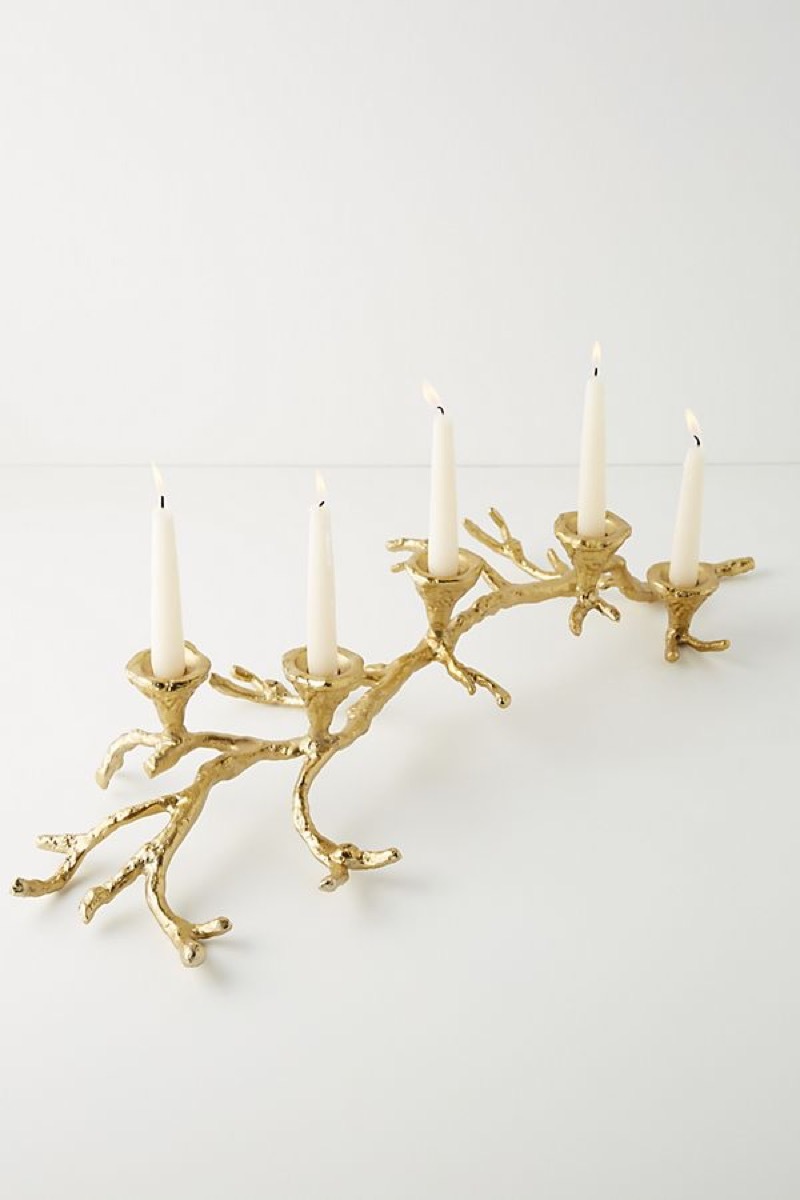 gold candle holder in the shape of a branch, kitchen decorations