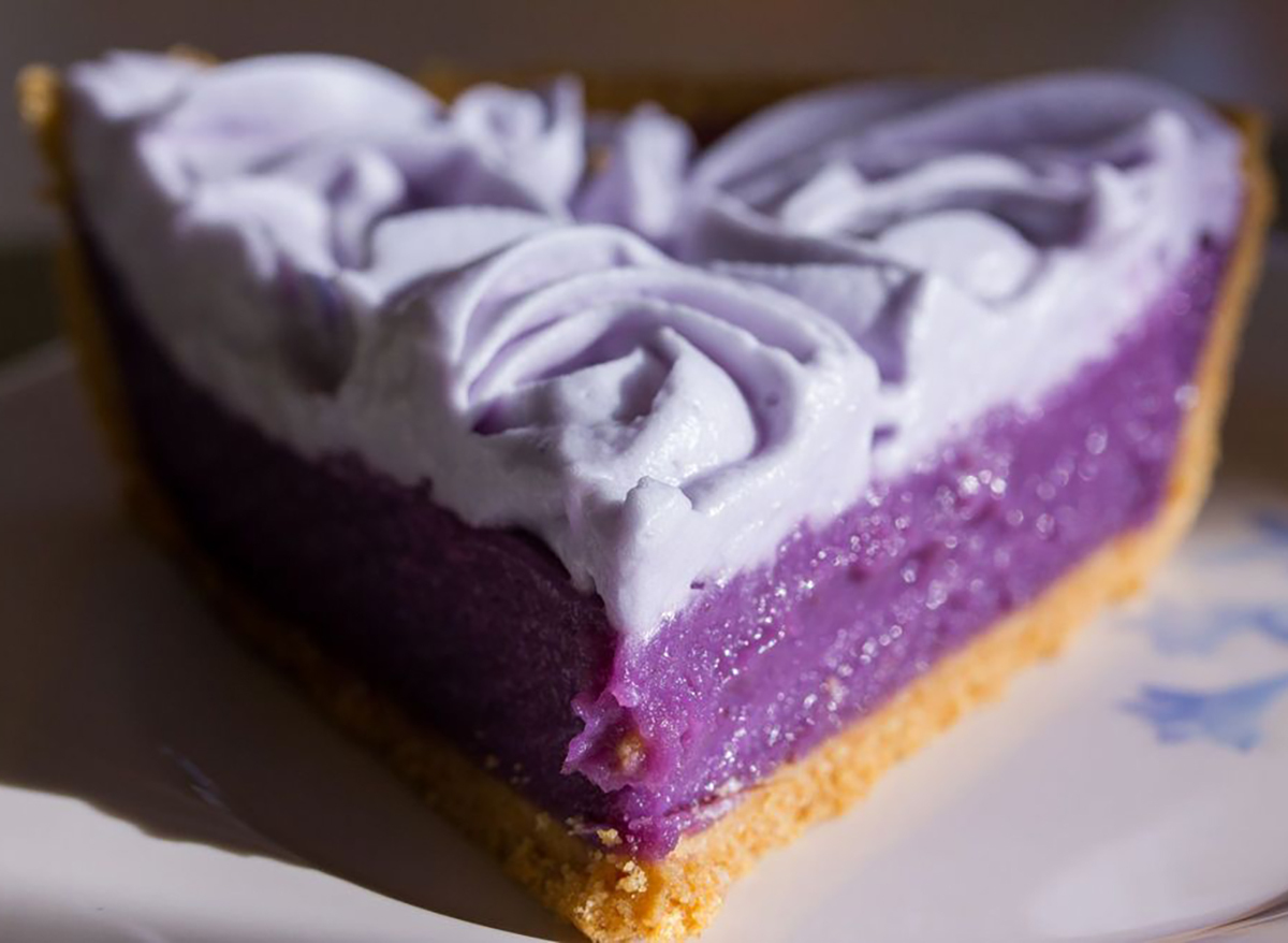 slice of ube pie with purple whipped cream