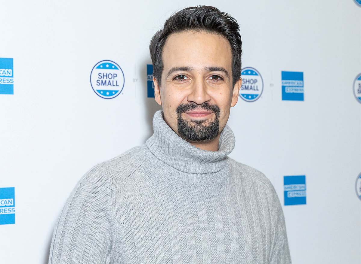lin manuel miranda on step and repeat in gray turtleneck