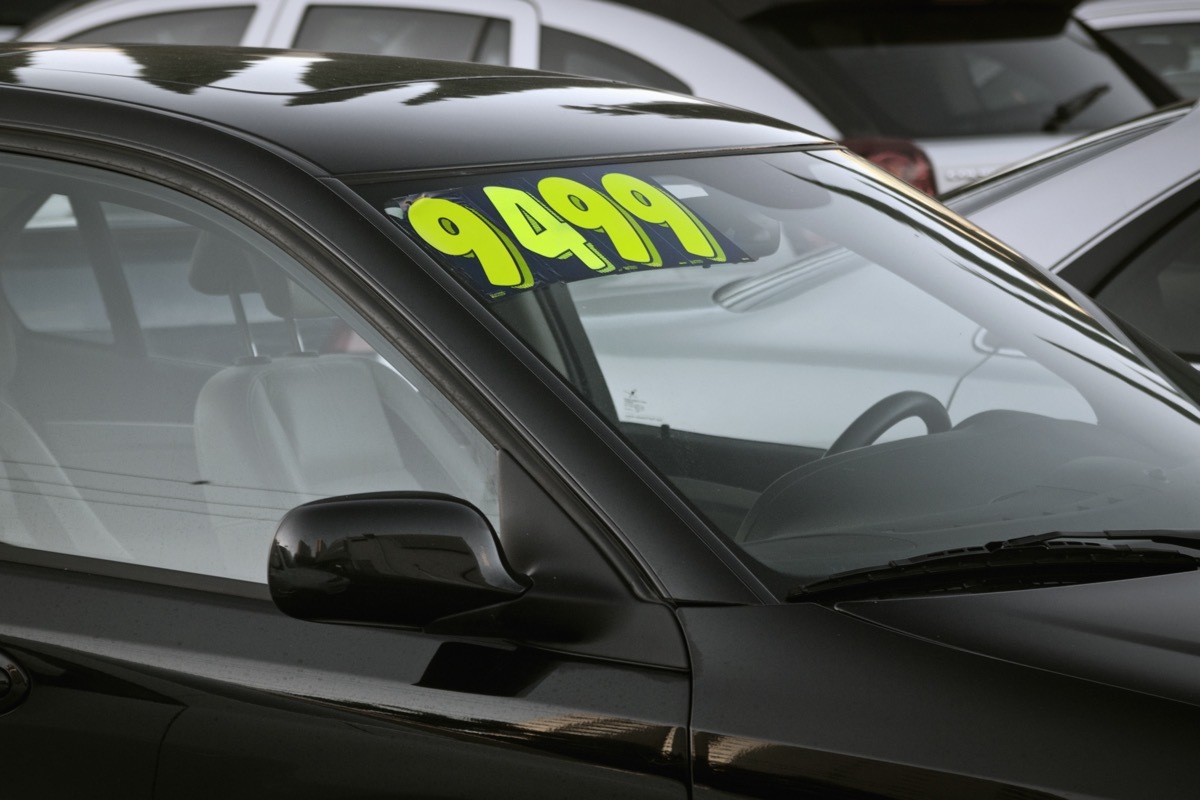 used car with price on the windshield