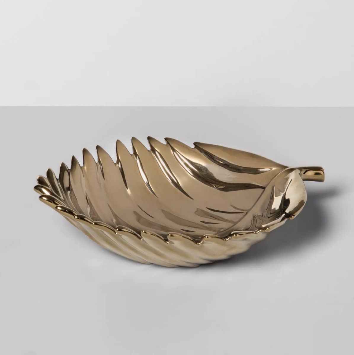 gold jewelry dish in the shape of a leaf, bathroom accessories