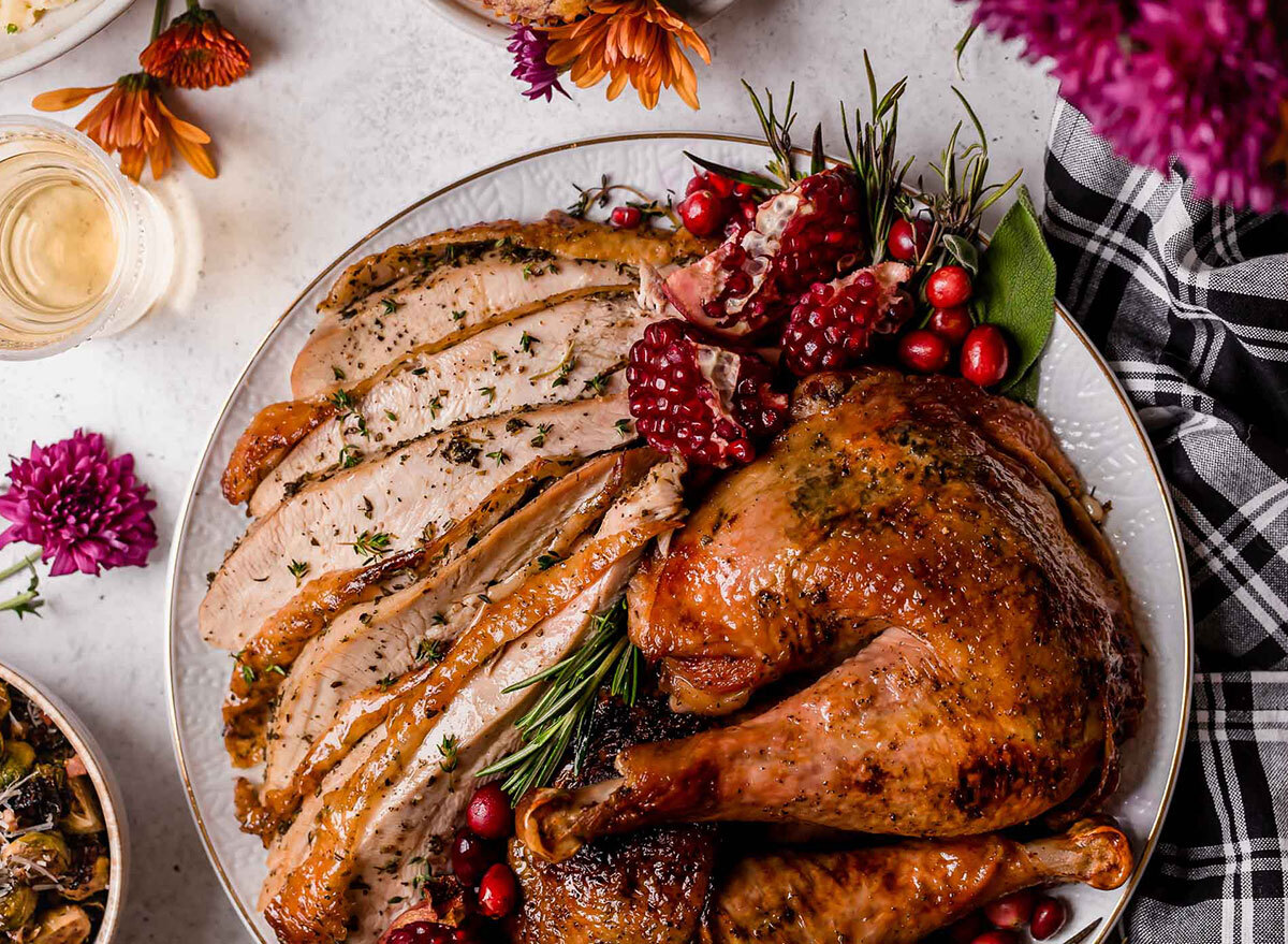 maple glazed turkey legs with sliced turkey breast on a plate