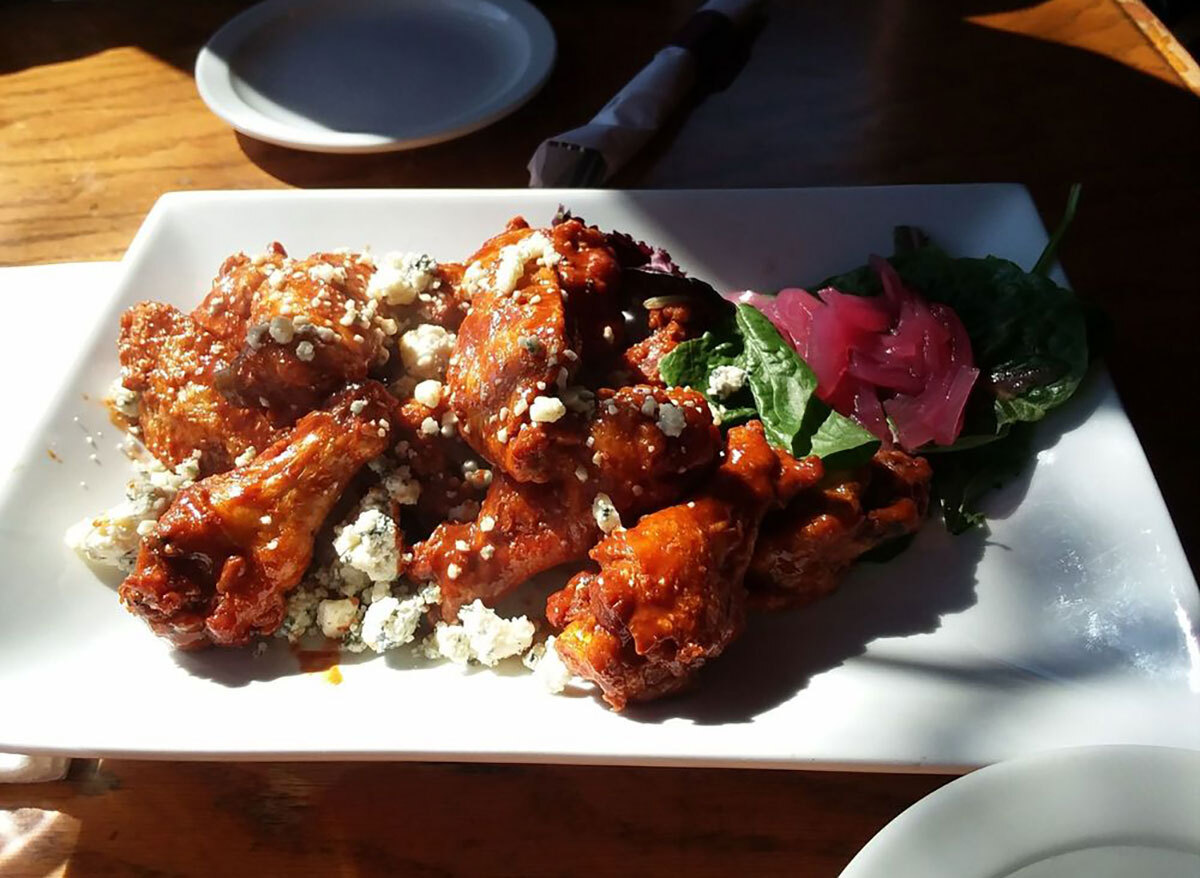 plated chicken wings with blue cheese crumbles