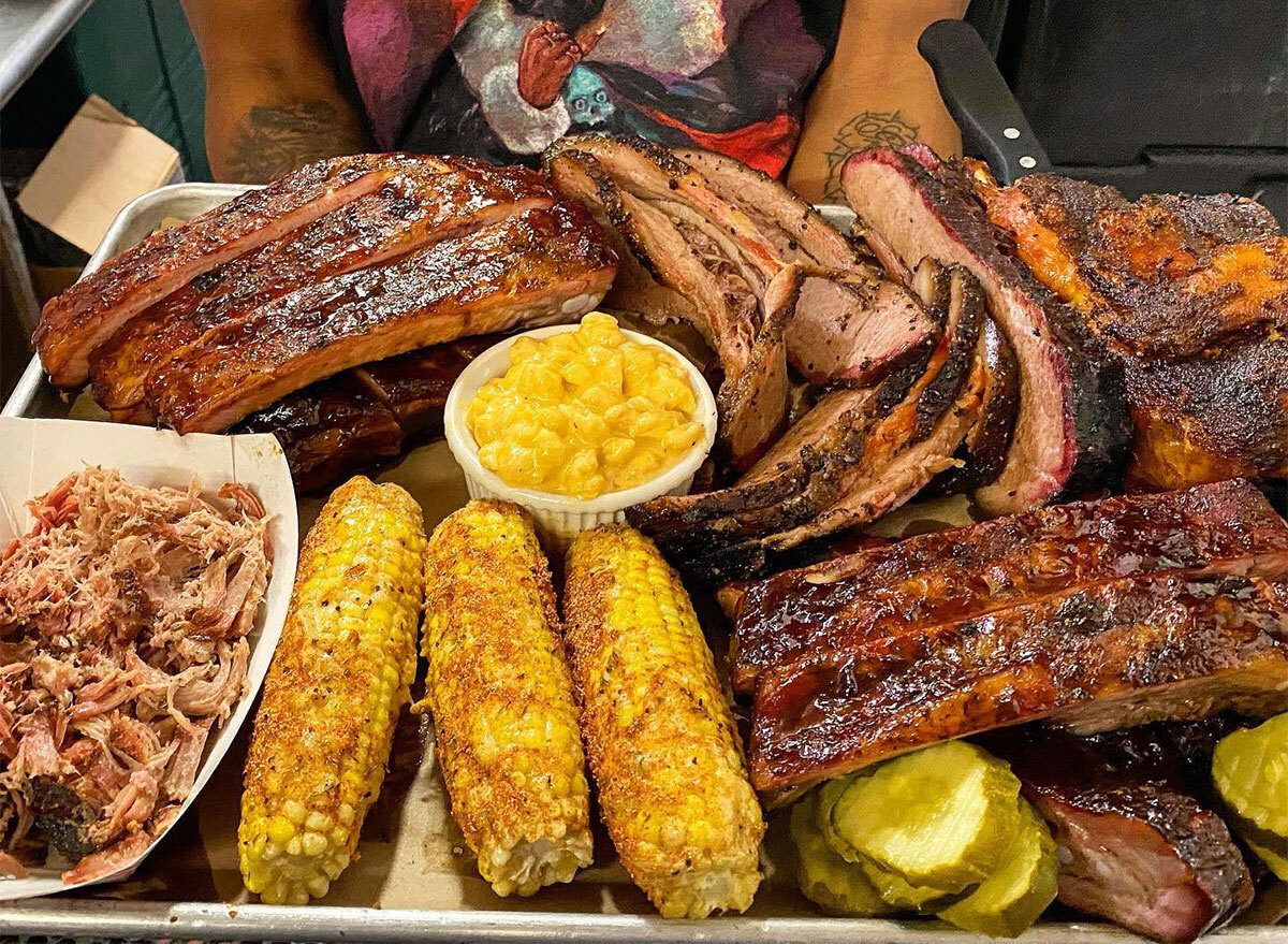 plate of barbecue with corn and mac and cheese