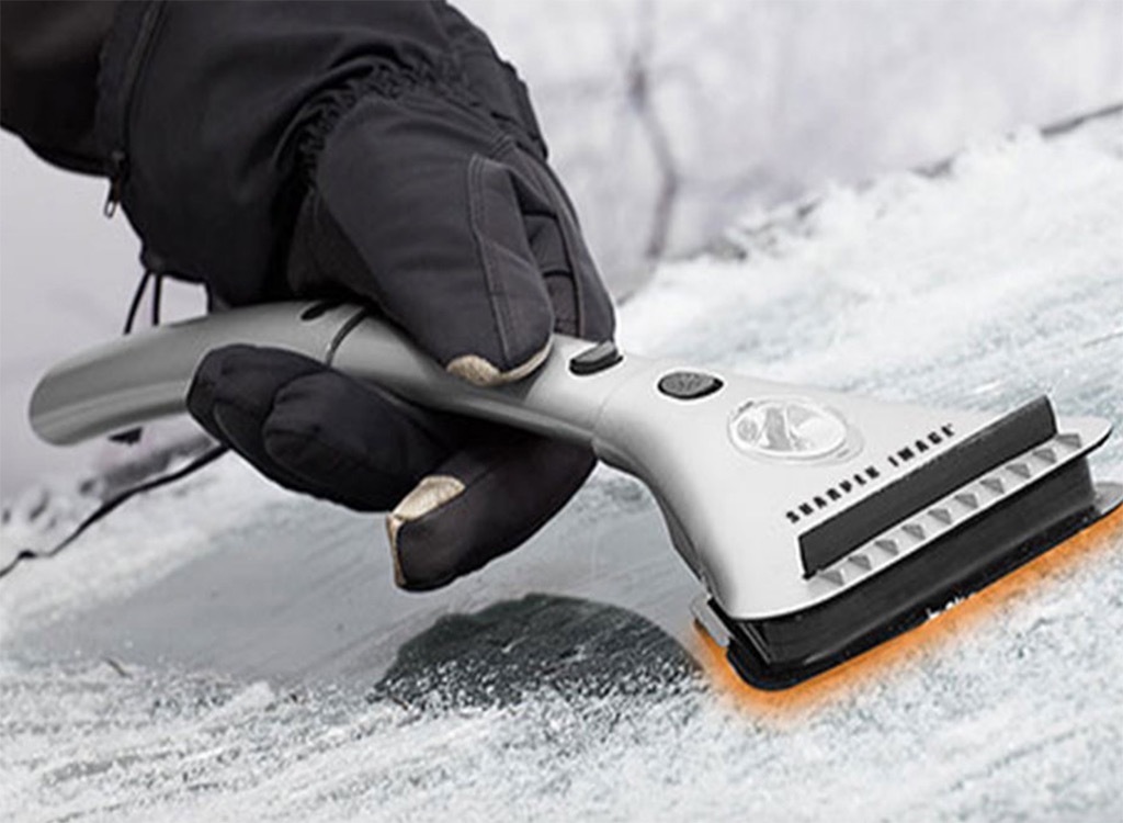 Heated ice scraper