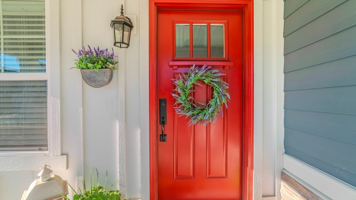 Red front door with wreath