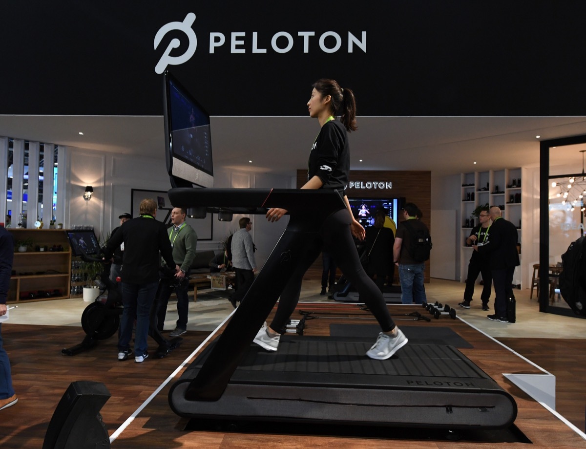 woman using peloton treadmill