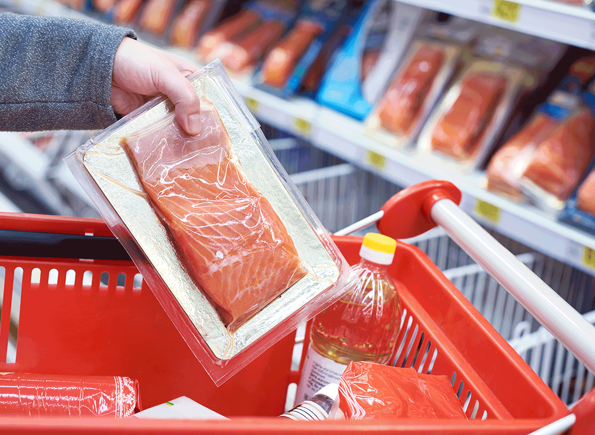 pre packaged salmon fillet placed in grocery cart