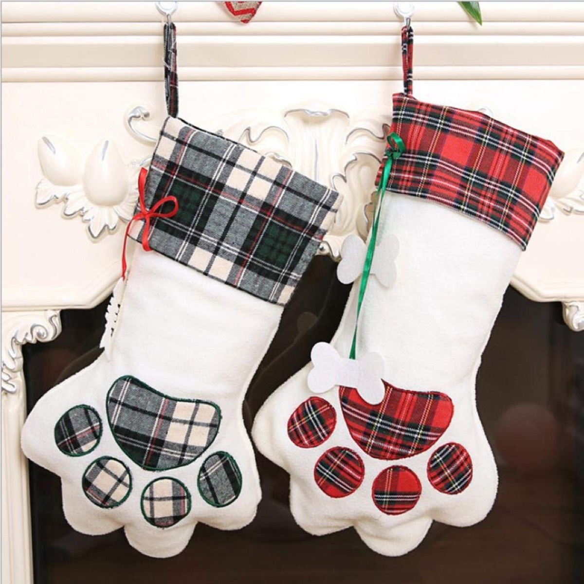 two plaid and white stockings in dog paw pattern