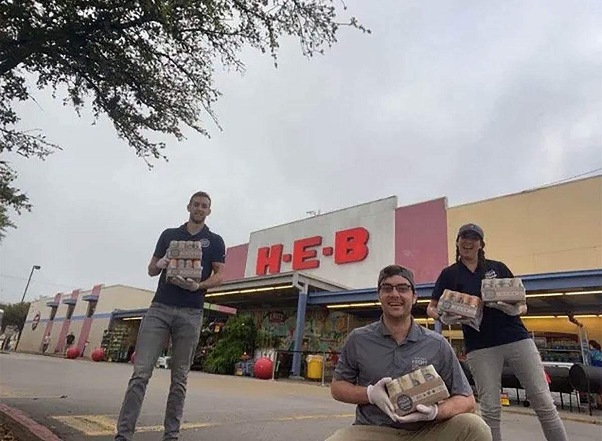 high brew coffee workers with cans in front of HEB grocery store