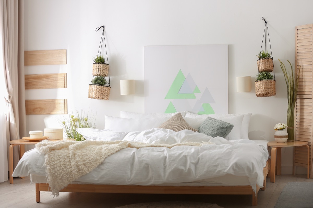 large modern painting on bedroom wall