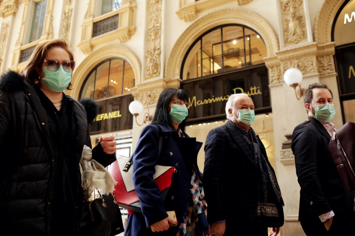 Coronavirus in Italy.Protective mask.Tourists in face masks at the Wiktor Emanuel II Gallery