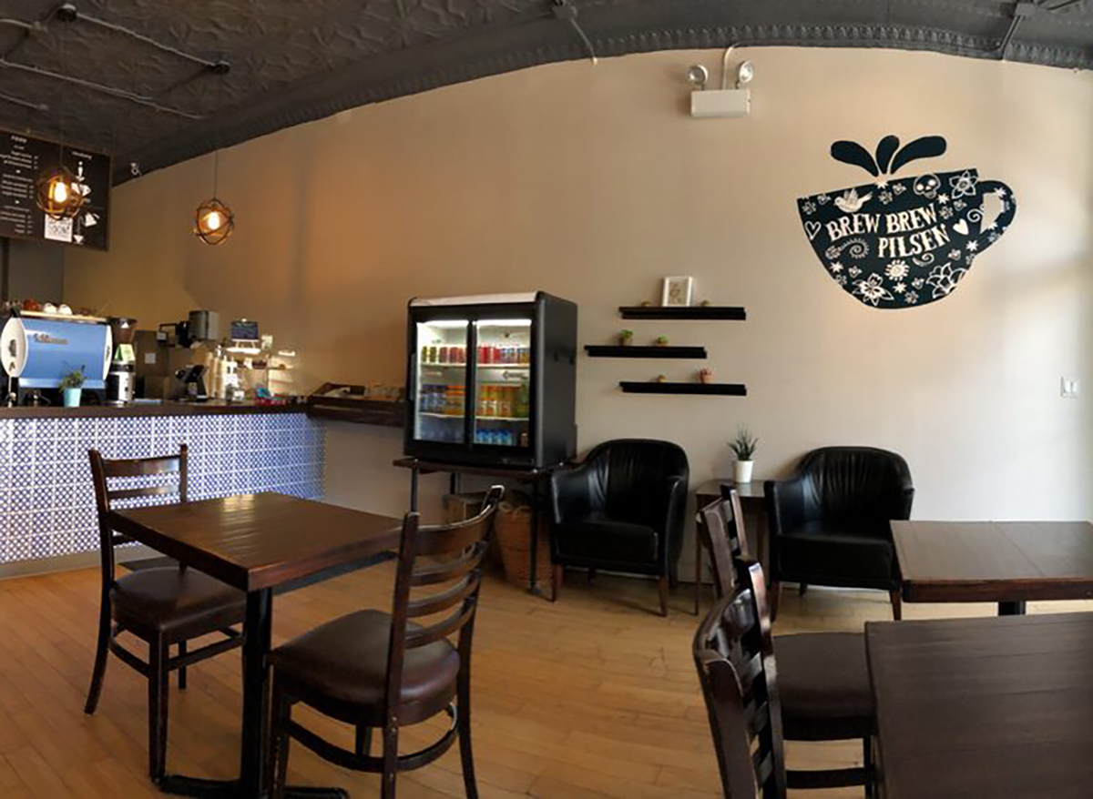 interior of brew brew coffee and tea in chicago with wooden tables and chairs