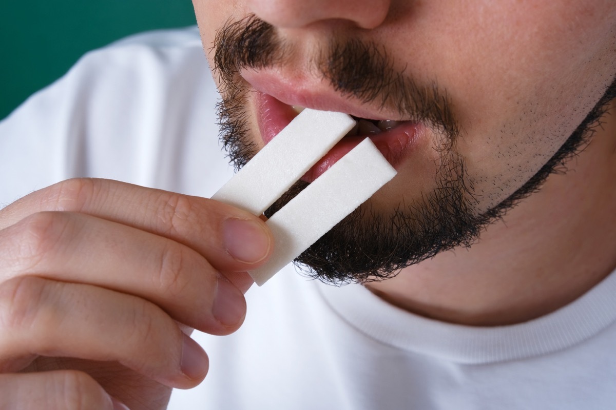 man eating mint gum after eating